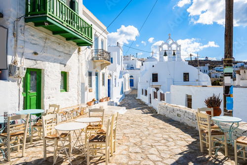 White church in narrow street of historic old part of Chora village, Amorgos island, Cyclades, Greece