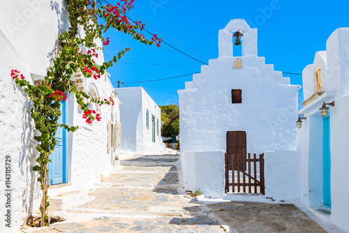 Fototapeta Naklejka Na Ścianę i Meble -  White church in narrow street of Chora village, Amorgos island, Cyclades, Greece