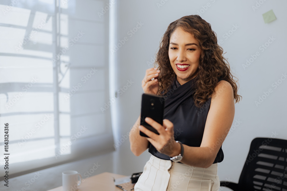 Mexican woman smiling in office Mexican woman smiling in office