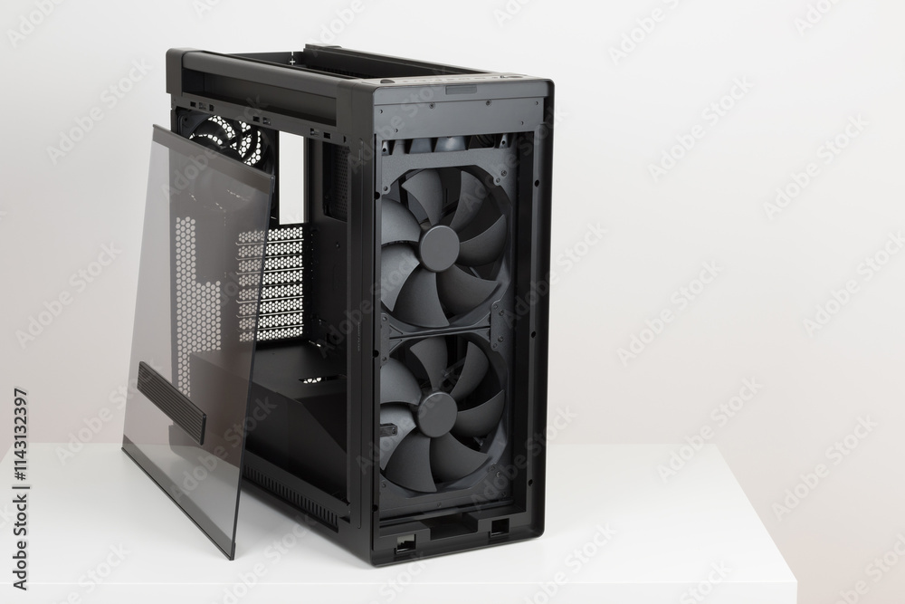 Fototapeta premium Side view of empty big tower, PC case, chassis, removable tempered-glass left panel, two extra-thick 200 x 38 mm front fans for maximum air intake