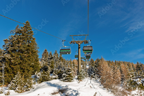 Ski lift on bright winter day photo