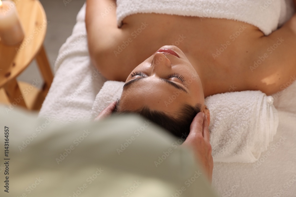 Woman receiving massage in spa salon, above view Woman receiving massage in spa salon, above view