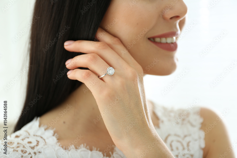 Young bride wearing beautiful engagement ring, closeup Young bride wearing beautiful engagement ring, closeup
