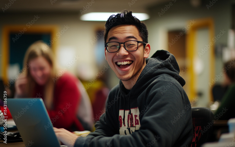 Obraz premium Smiling student using laptop in study environment with peers at a college campus