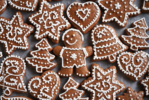 Homemade gingerbread Christmas cookie decorated with white icing, top view