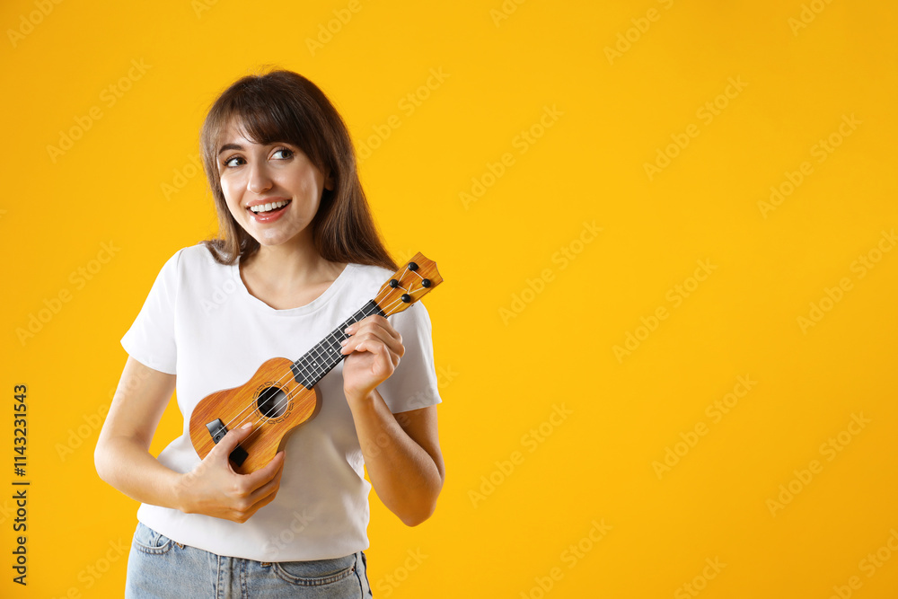 Happy woman playing ukulele on orange background, space for text Happy woman playing ukulele on orange background, space for text