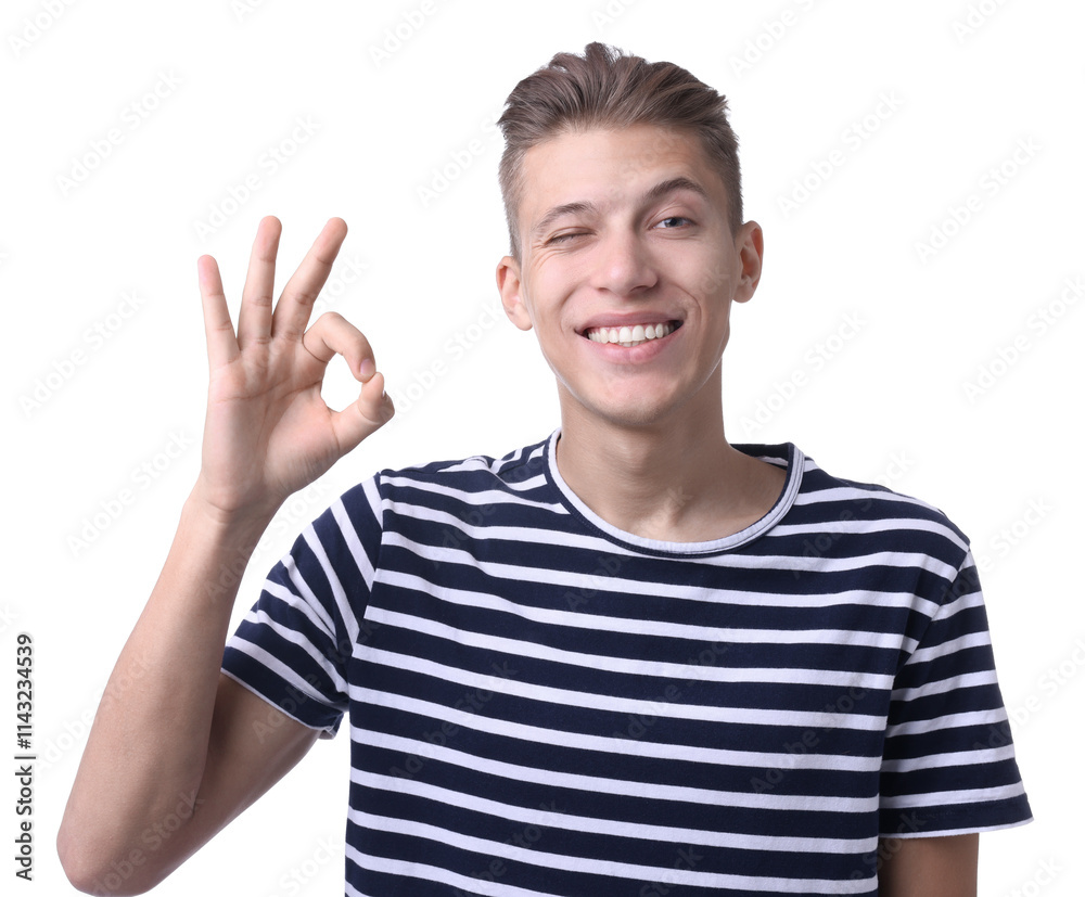 Happy young man showing OK gesture on white background Happy young man showing OK gesture on white background