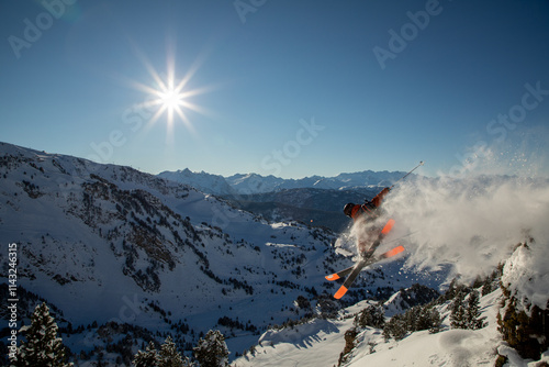 Freeride skier in action amid stunning mountain landscape photo