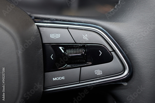 The modern cars steering wheel control panel boosts convenience and performance