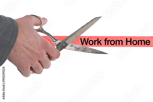 Isolated male hand with scissors cutting through red tape with work from home written on it