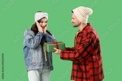 Young man giving Christmas ...