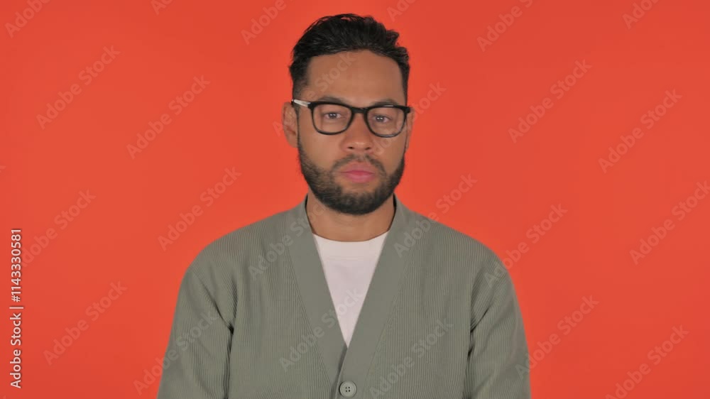 Tense Casual Hispanic Man in Denial on Red Background, Portrait Tense Casual Hispanic Man in Denial on Red Background, Portrait
