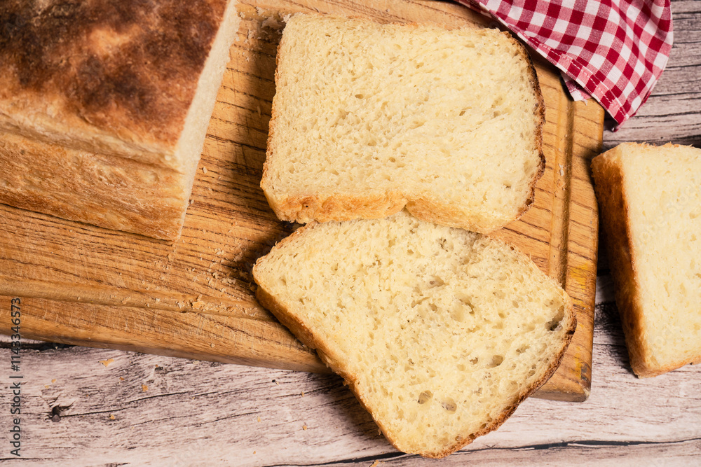 Slices of white bread on a cutting board. aereal view. Slices of white bread on a cutting board. aereal view.