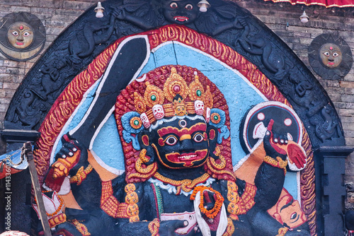 Kaal Bhairav  -An open air temple with a powerful manifestation of the Hindu god Shiva as Bhairav built in black stone by King Pratap Malla  at historic Durbar square,Nepal  photo