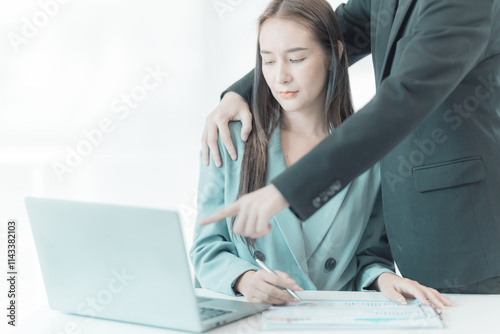 The female employee is uncomfortable. Look at the hand of your boss or male co-worker as they touch your shoulder and embrace. inappropriate sexual harassment photo