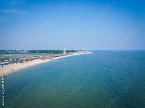 Bohai Bay Dongdaihe summer seaside scenery showcases tranquil shoreline and clear blue waters photo