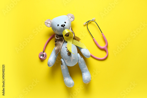 Yellow ribbon, teddy bear a...
