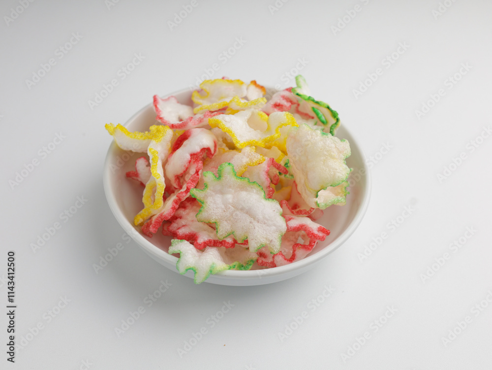 Crackers with shrimp flavor on white bowl Crackers with shrimp flavor on white bowl