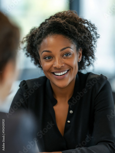 Opportunity. Ambition. New beginnings.Job interview, recruitment, professional portrait, employment, career growth, business flyer, motivational image. Young woman in black blouse smiling during job i