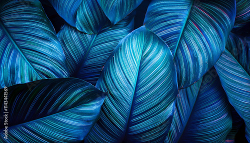 Creative fluorescent color layout made of tropical leaves. Flat lay neon colors. Nature concept.