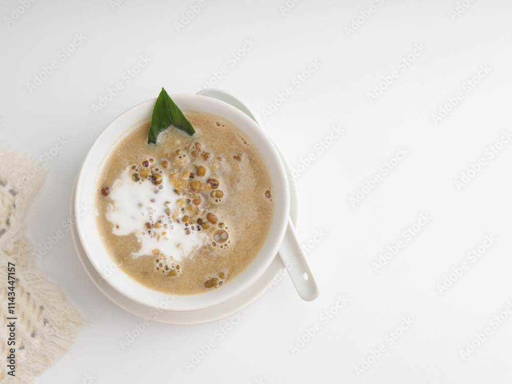 Mung bean porridge cooked with coconut milk and palm sugar in a bowl Mung bean porridge cooked with coconut milk and palm sugar in a bowl