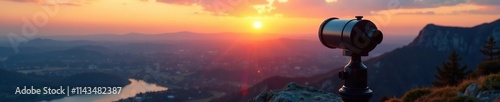 Binoculars positioned on top of a rocky outcropping at sunset with a panoramic view, focal, landscape, panorama photo