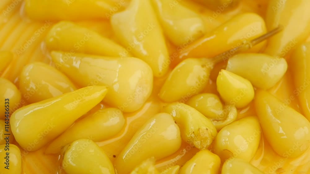 Top View of Pickled Vegetables in a Yellow Ceramic Bowl on Table