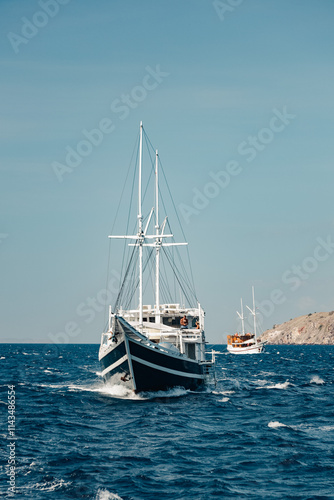 Pinisi boat behind our sail boat
