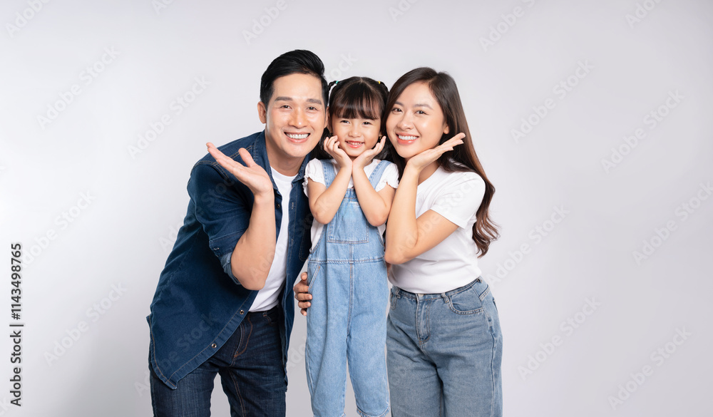 Fototapeta premium portrait of a happy asian family posing on a white background