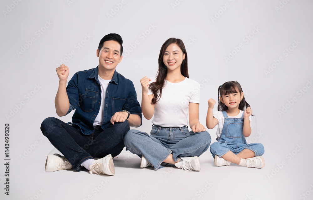 Full body image of Asian mother and daughter posing on white background Full body image of Asian mother and daughter posing on white background