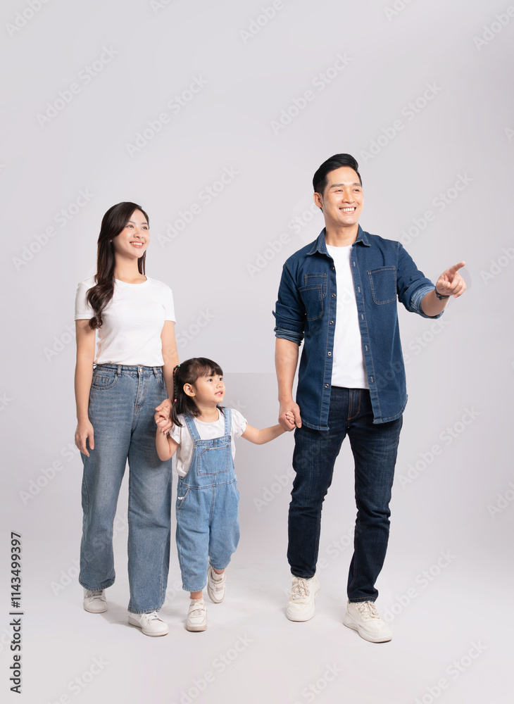 Full body image of Asian mother and daughter posing on white background Full body image of Asian mother and daughter posing on white background