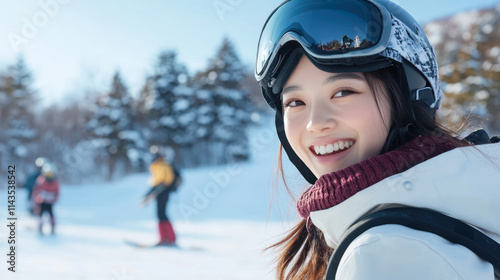 Japanese woman snowboarding with helmet and goggles at slope snow mountain
