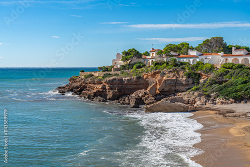 A house at the coastline from the les Tres Cales - the three Coves - in Catalunya in Spain photo