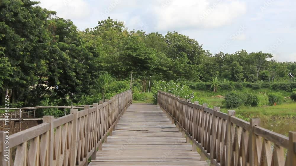 Wooden Bridge with a background of cloudy blue sky. Located in Boyolali Wooden Bridge with a background of cloudy blue sky. Located in Boyolali