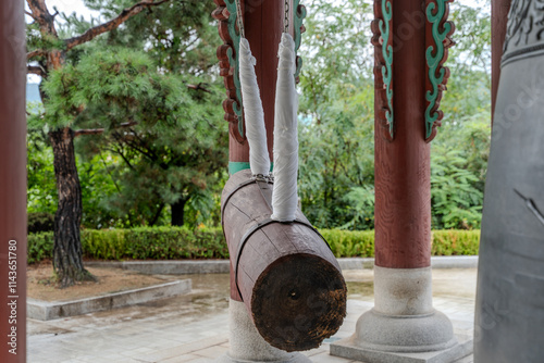 A ceremonial bell ringing in the New Year, housed in a traditional bell pavilion, symbolizing new beginnings and harmony. photo