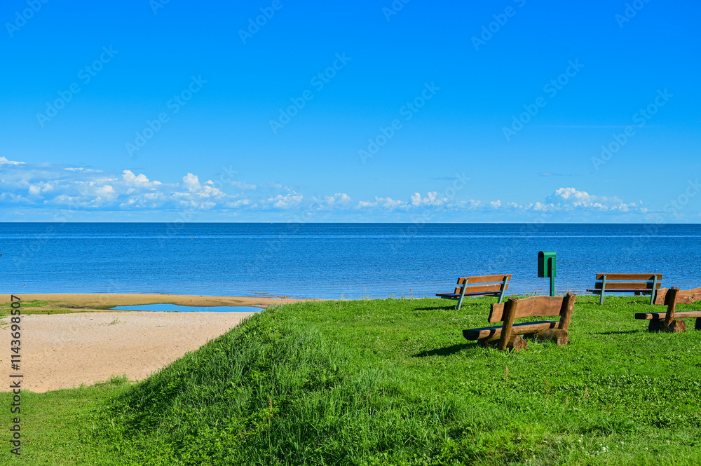 Summer view over the sandy beach to Lake Peipus (Peipsi-Pihkva järv) under a blue sky in summer near Kallaste, Tartu, Estonia Summer view over the sandy beach to Lake Peipus (Peipsi-Pihkva järv) under a blue sky in summer near Kallaste, Tartu, Estonia
