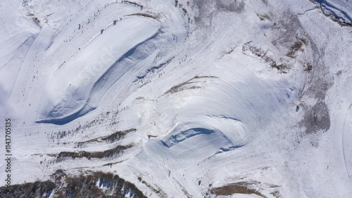 Aerial view of snow covered countryside terraces in the mountains