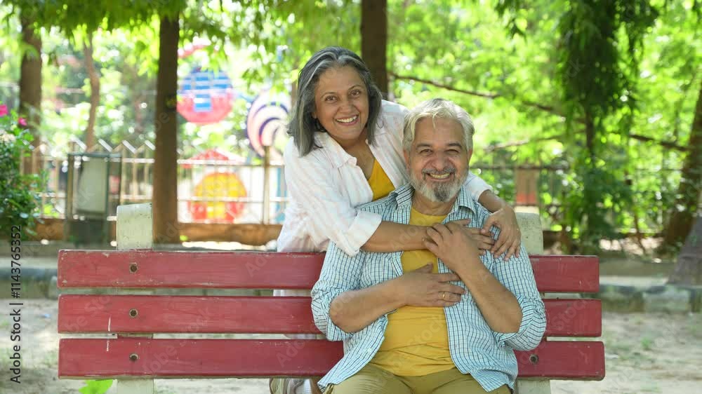 Portrait of happy retired senior indian couple sitting together at summer park. Mature husband wife bonding and love. Retirement life. Portrait of happy retired senior indian couple sitting together at summer park. Mature husband wife bonding and love. Retirement life.