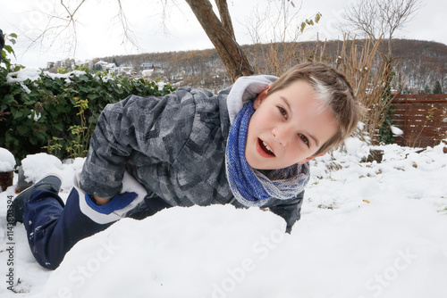 Photography Boy playing on snow and enjoying winter outdoors