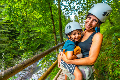 Mother and son enjoying hiking in vintgar gorge, slovenia photo