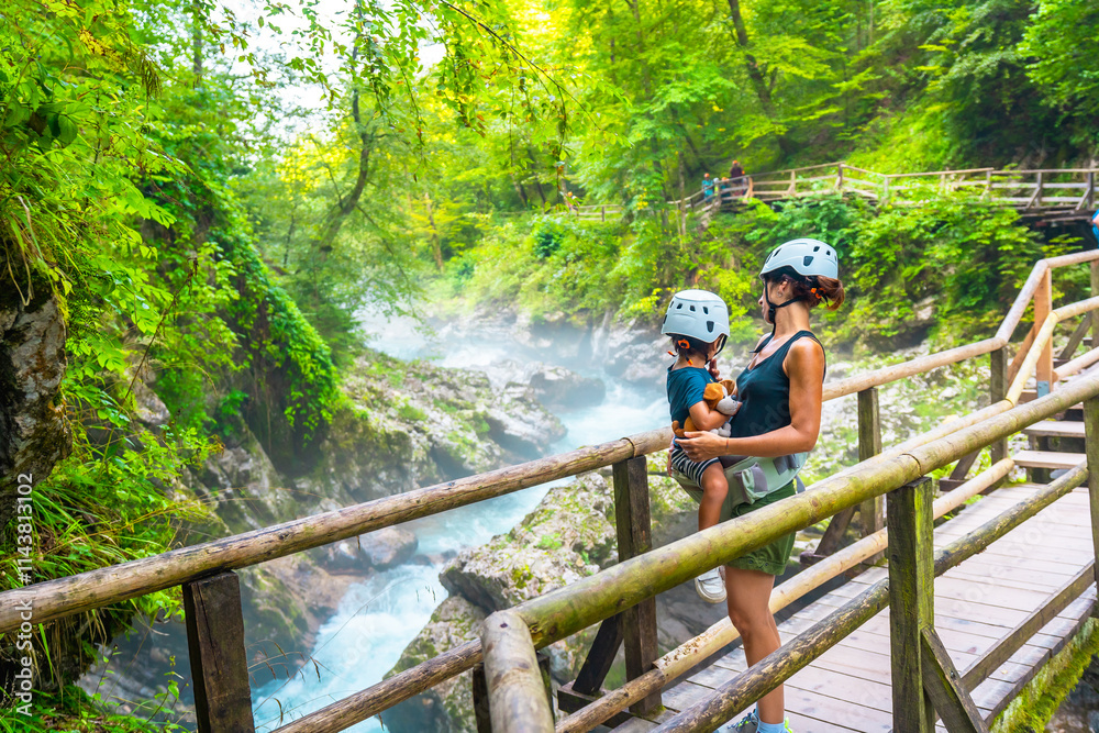 Mother and child exploring vintgar gorge in bled, slovenia Mother and child exploring vintgar gorge in bled, slovenia