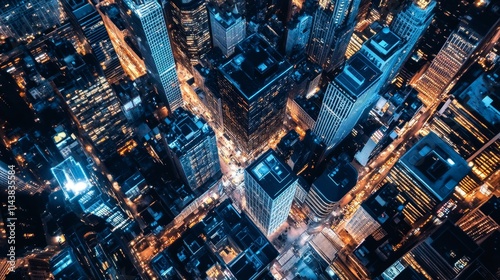 Aerial view of a vibrant city, backgroundscape illuminated at night.