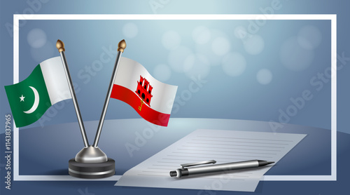 Pakistan and Gibraltar National flags on small table with bokeh background, cooperative relationship