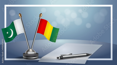 Pakistan and Guinea National flags on small table with bokeh background, cooperative relationship
