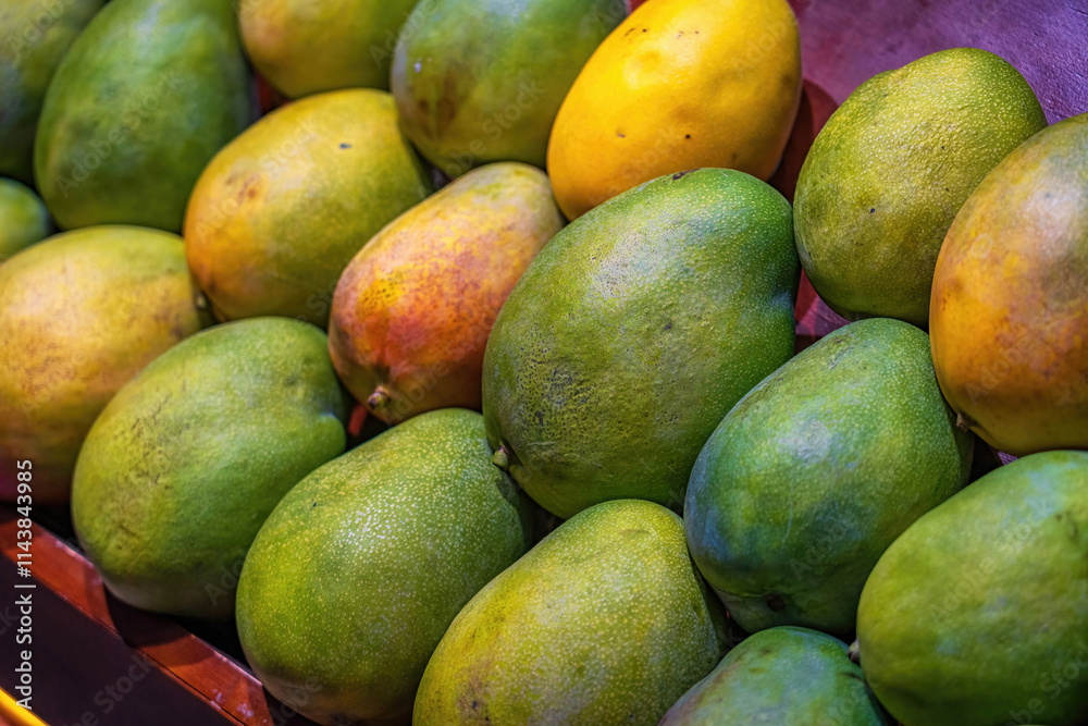 Fresh Tropical Mangoes in a Market Display Fresh Tropical Mangoes in a Market Display