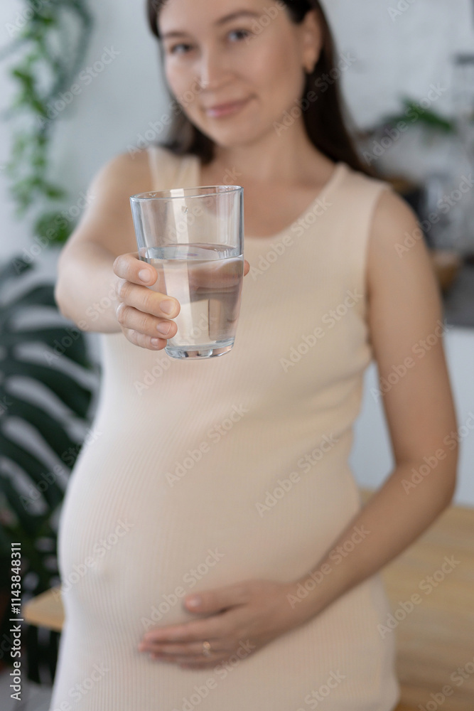 pregnant woman with glass of clean drinking water, drinking water. concept of pregnancy health care pregnant woman with glass of clean drinking water, drinking water. concept of pregnancy health care