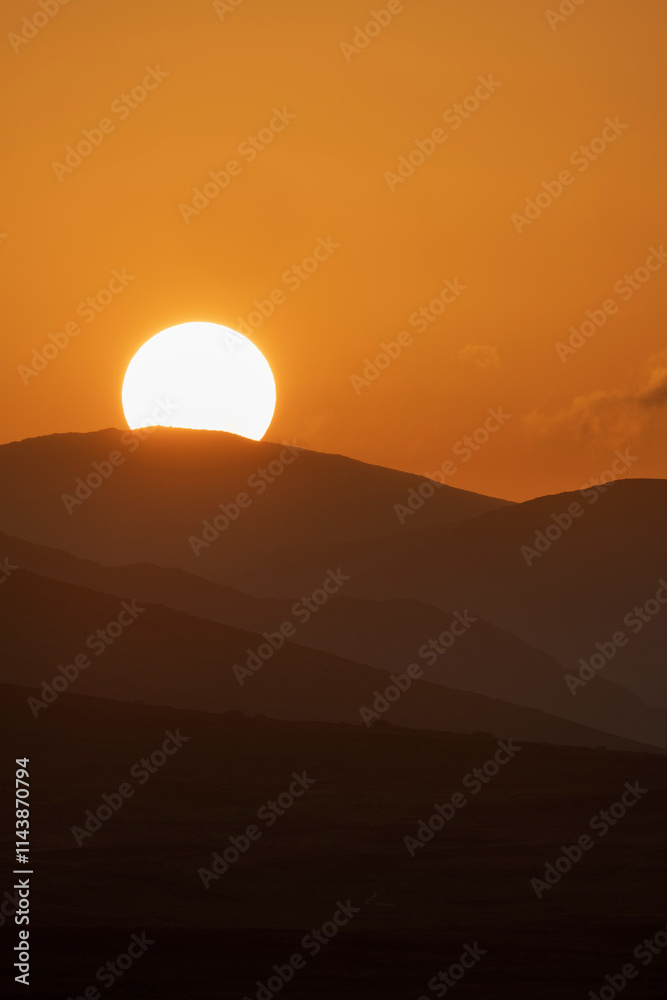 Scenic view of sunset over mountains Scenic view of sunset over mountains
