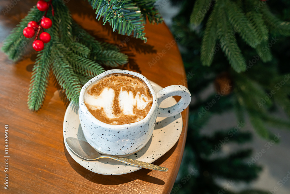 Close up of Hot coffee latte with latte art milk foam in cup mug with Xmas decors and Xmas tree baubles on wood desk Celebrating Merry Christmas and New year,Merry x-mas
