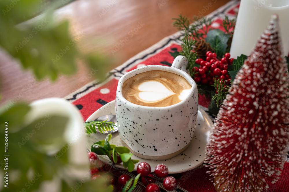 Close up of Hot coffee latte with latte art milk foam in cup mug with Xmas decors and Xmas tree baubles on wood desk Celebrating Merry Christmas and New year,Merry x-mas
