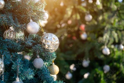 Obraz na płótnie Merry x-mas,Close up of Colorful balls ,gifts box and Christmas greeting picture parcel,bell decoration on Green Christmas tree background Decoration During Christmas and New Year. w salonie